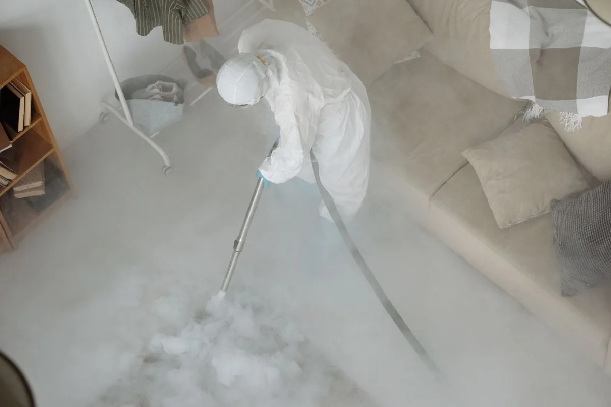 Biohazard cleanup technician in protective equipment, Masterson Station, Lexington, KY